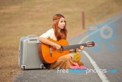 Hippie Woman Playing Music Stock Photo