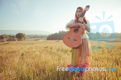 Hippie Woman Walking In Golden Field Stock Photo