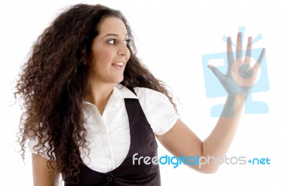 Hispanic Female Posing With Curly Hairs And Showing Palm Stock Photo