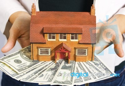 House And Dollar Bills Stock Photo