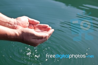 Human Hands Splashing Pure Water Stock Photo