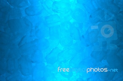 Ice Cube In Blue Light Stock Photo