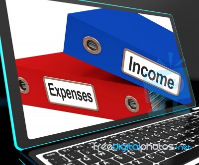 Income And Expenses Files On Laptop Shows Budgeting Stock Image
