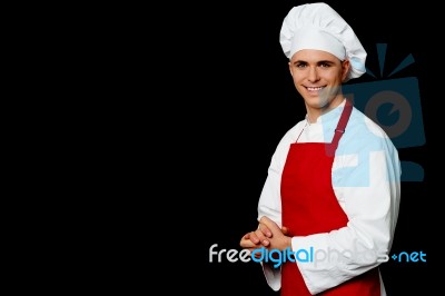 Isolated Male Chef Over Black Background Stock Photo