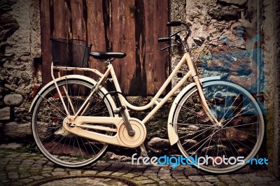 Italian Old-style Yellow Bicycle Stock Photo