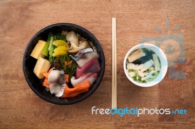 Japanese Food Tekka Don Take Away On Wooden Background Stock Photo