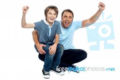 Joyous Father And Son Cheering Loud Stock Photo