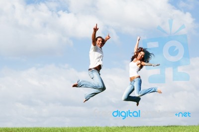 Jumping For Joy Outdoors Stock Photo