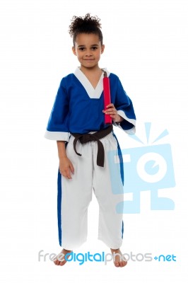 Karate Girl Holding Nunchucks Stock Photo