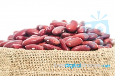 Kidney  Beans In Sacks Fodder On White Background Stock Photo