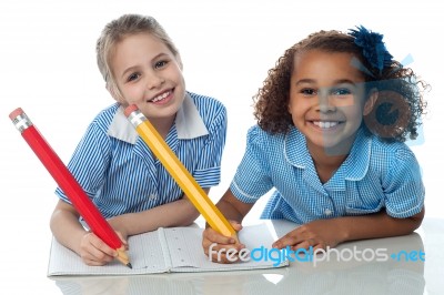 Kids Writting Their Assignment Stock Photo