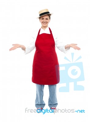 Lady Chef Showing Open Palms Stock Photo