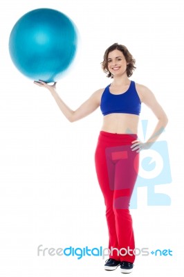 Lady Gym Instructor Holding Pilates Ball Stock Photo