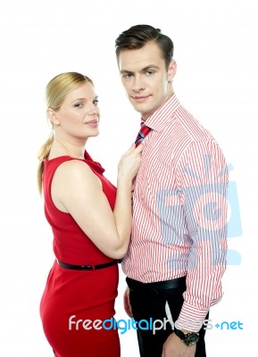 Lady Holding Her Corporate Male Tie Stock Photo