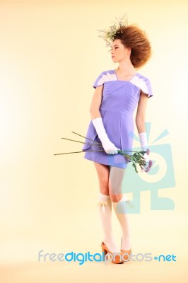 Lady In Purple Dress With Flowers Stock Photo