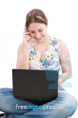 Lady Talking Over Phone With Laptop Stock Photo