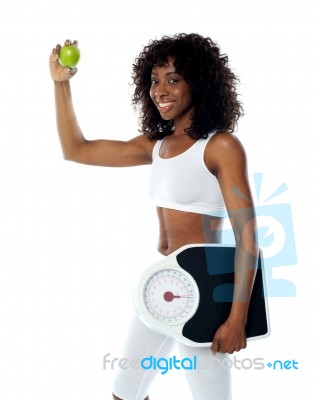 Lady With Apple And Weighing Scales Stock Photo