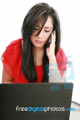 lady with laptop and phone Stock Photo