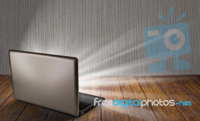 Laptop On Table With Light Out Stock Photo