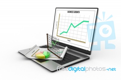 Laptop Showing A Spreadsheet And A Paper With Statistic Charts Stock Image