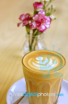 Latte Or Cappuccino Coffee With Flower Stock Photo
