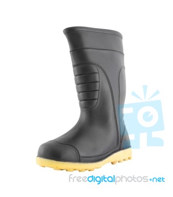 Left Side Of Rubber Black Boot Shoe On White Background Stock Photo