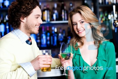 Let's Celebrate. Young Couple At Nightclub Stock Photo