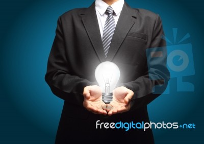 Light Bulb In Hand Stock Image