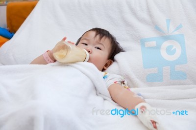 Little Asian Girl Lying  On A Medical Bed Stock Photo