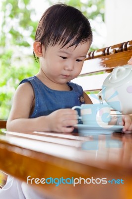 Little Asian Girl (thai) Holding A Cup Stock Photo