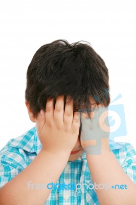 Little Boy Covering His Face Stock Photo