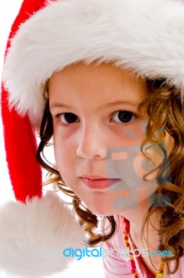 Little Girl Wearing Christmas Hat Stock Photo