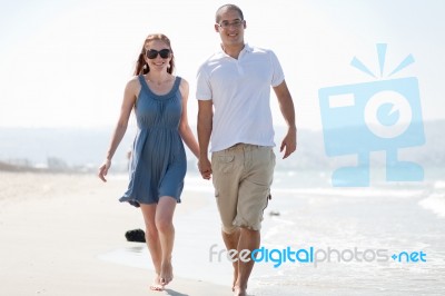 Love Couple Walk On The Beach Stock Photo