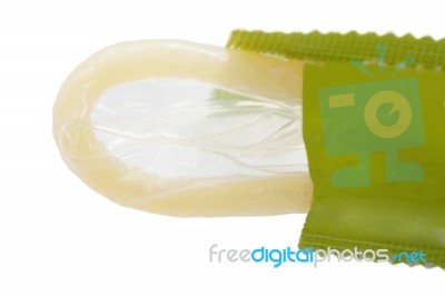 Macro Shot Of A Condom Ready To Be Used Stock Photo - Royalty Free