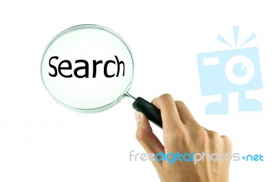 Magnifying Glass In Hand Stock Photo