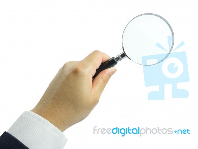 Magnifying Glass In Hand Stock Photo