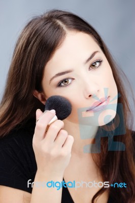 Makeup With Powder Brush Stock Photo