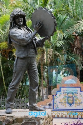 Malaga, Andalucia/spain - July 5 : Statue Of Man Holding A Tambo… Stock Photo