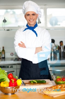 Male Chef Chopping Vegetables In Table Stock Photo
