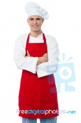 Male Chef Standing With Arms Crossed Stock Photo