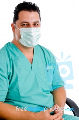 Male Doctor Posing With Face Mask Stock Photo