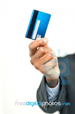 Male Hand Holding Up A Credit Card Stock Photo