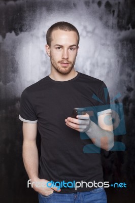 Male holding smartphone Stock Photo