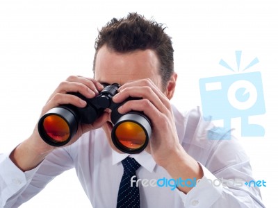 Male Looking Through Binoculars Stock Photo