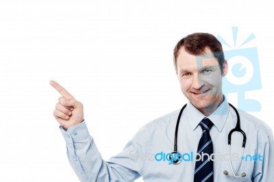 Male Physician Pointing At Something Stock Photo