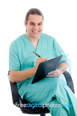 Male Surgeon Writing Prescription Stock Photo