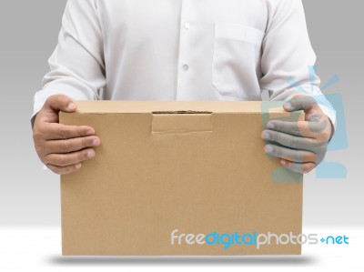 Man Carrying Cardboard Box Stock Photo