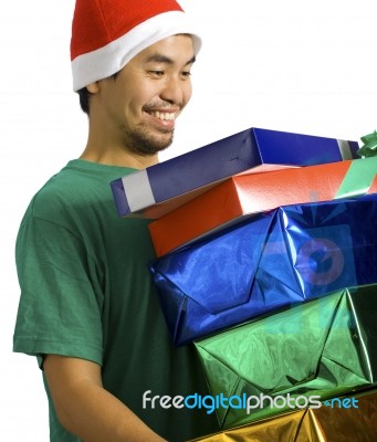 Man Carrying Lots Of Presents Stock Photo