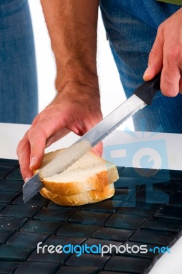 Man Cutting Sandwich  Stock Photo