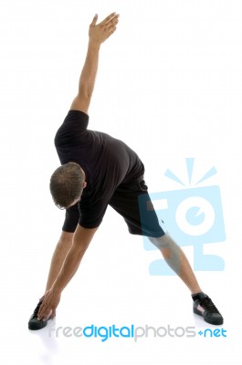 Man Doing stretching Exercise Stock Photo